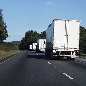 Trucks Driving on the Road